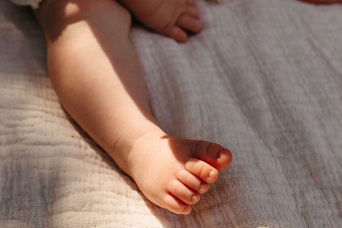 Baby feet in warm light